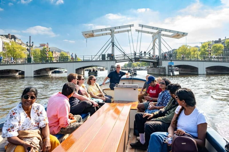 Amsterdam: 75 minute Open Boat Canal Cruise with Live Guide - Exploring the Canals and the Neighborhoods