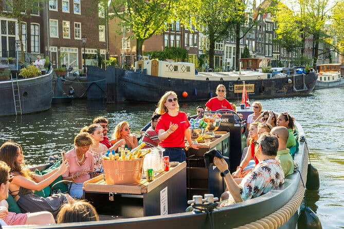 Amsterdam: Guided Open Boat Canal Cruise Including 1 Drink - Exploring the Itinerary in Detail