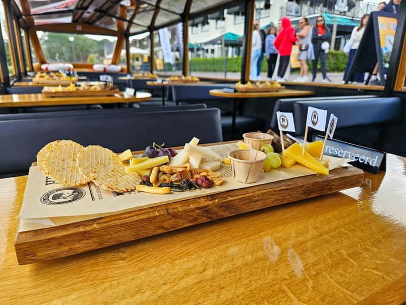 Amsterdam: Live GuideD Giethoorn Boat Tour & Cheese Platter - Exploring Giethoorn at Your Own Pace