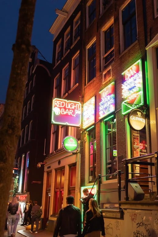 Amsterdam: Red Light Tour Exclusive + Peep Show - Discovering the Heart of the District