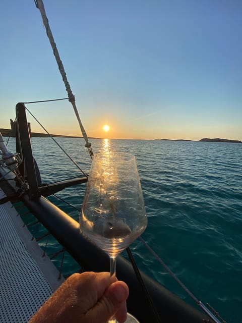 aperitifs at sunset on the Stintino catamaran burianaCharter - Who Will Love This Experience?