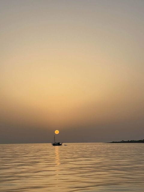 Argostoli: Sunset Cruise with Swim Stops, Dinner, and Wine - Swimming, Snorkeling, and the Red Sands of Xi Beach