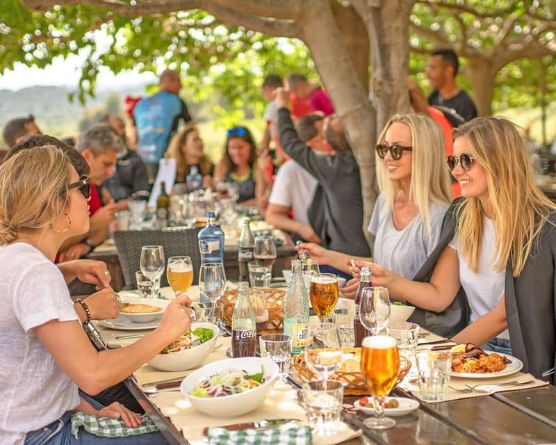 Barcelona: Montserrat Visit & Lunch at Farmhouse Small Group - Entering the Magnificent Montserrat Mountain