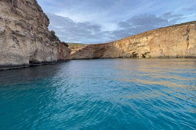 Blue Lagoon Ferry and Caves Tour - Entering The Blue Lagoon: The Heart of the Tour