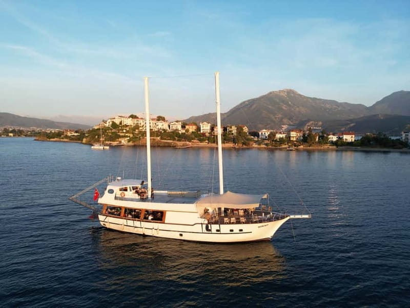 Fethiye: 12 Islands Boat Tour with Lunch and Transfer Option - Kızıl Ada: The Reddish Sands and Sunset Views