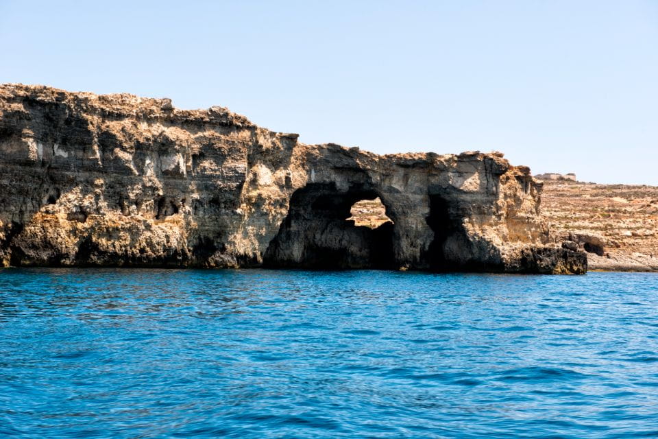 From Gozo:Around Comino, Blue Lagoon, Crystal Lagoon & Caves - Onboard Lunch and Beverages