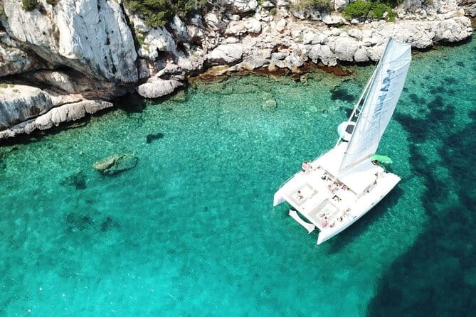 Full day Catamaran cruise in Porto Conte Natural Park - Practical Tips for Booking and Enjoying the Tour