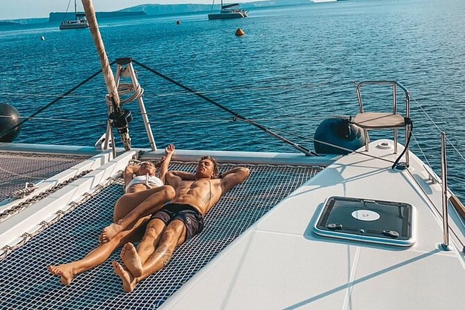 Half-Day Exclusive Catamaran Cruise in Santorini With Meal and Open Bar - Exploration of Santorinis Unique Coastal Regions