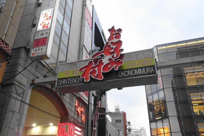 Hiroshima Local Life Walking Tour - Indulging in Okonomimura Food Stalls