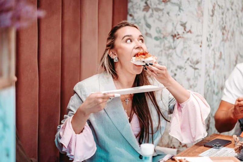 Krakow: Tipsy Polish Food Tour With History, Pierogi & Shots - The Experience: Walking Through Krakow with a Flavorful Twist