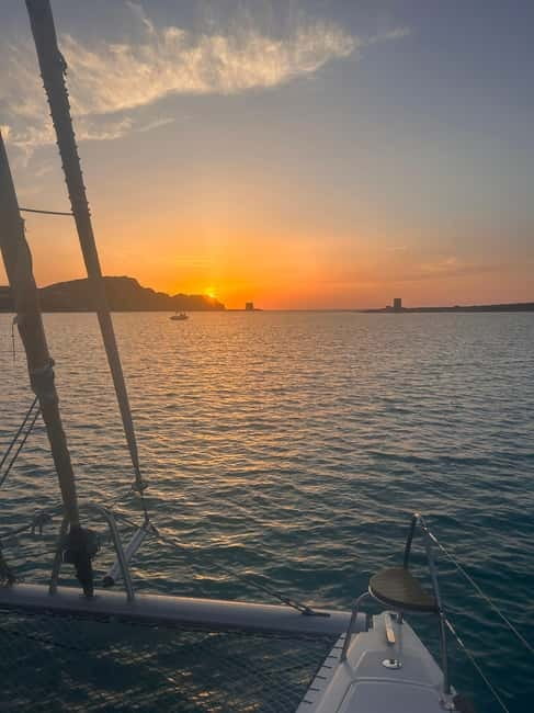La pelosa: Sunset catamaran tour with aperitif - Starting Point and Departure Timing: Ease and Convenience