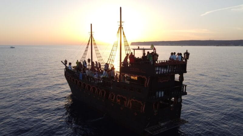 Lampedusa: Sunset Dolphin Sighting on a Pirate Ship - A Unique Setting: The Pirate Ship Experience