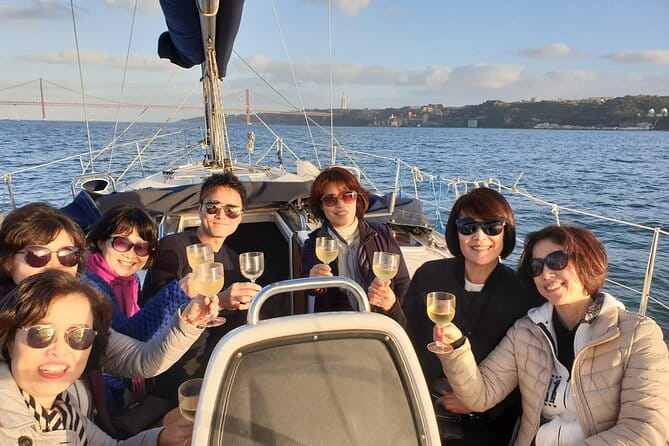 Lisbon Day Boat Tour with wine and guided tour - The Experience Onboard: What to Expect