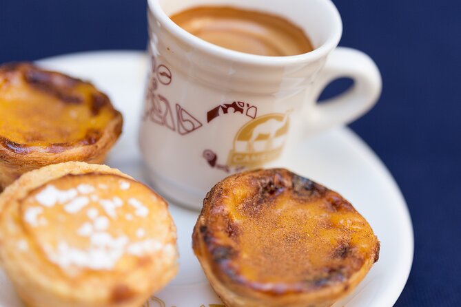 Lisbon Small-Group Walking Tour: Wine, Seafood Lunch, Ferry Ride - Tasting Traditional Pastries and Seafood