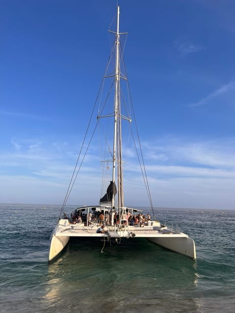 Lloret De Mar: Sunset Catamaran Cruise With DJ and Drinks - Key Points