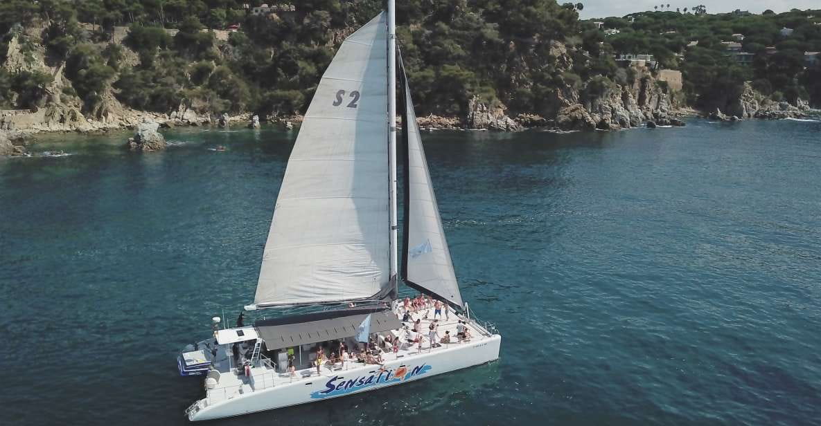 Lloret De Mar: Sunset Catamaran Cruise With DJ and Drinks - Pricing and Booking Details