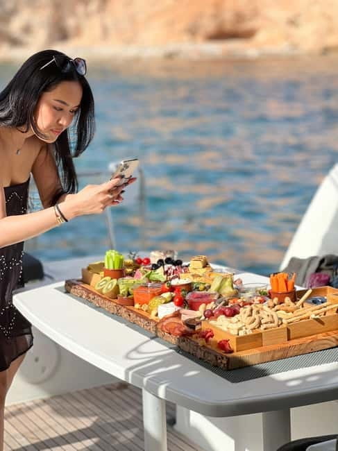 Majorca: Dinner aboard a private catamaran with snorkeling and paddle surfing - Key Points / Takeaways