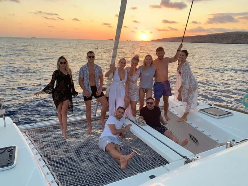 Majorca: Dinner aboard a private catamaran with snorkeling and paddle surfing - Sailing Back: A Nighttime Panorama of Palma