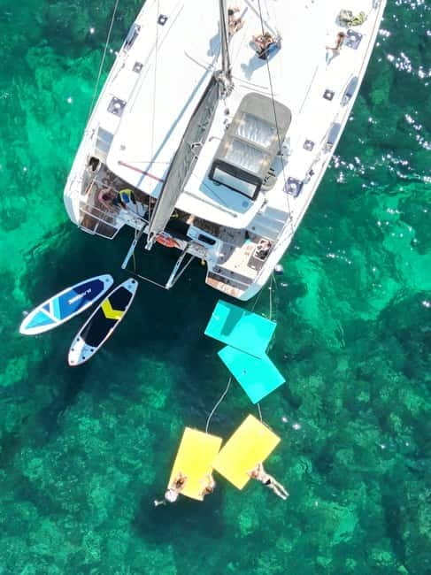 Majorca: Dinner aboard a private catamaran with snorkeling and paddle surfing - Price and Value