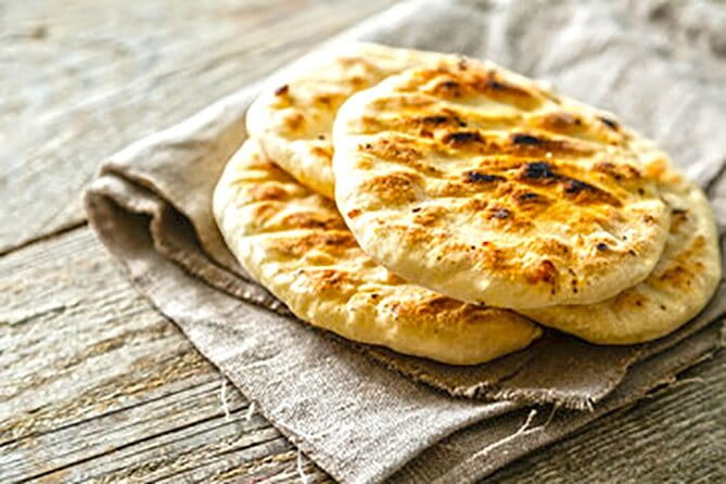 Miss Anna Cooking Class with Wines in Santorini - Cooking, Sharing, and Laughing