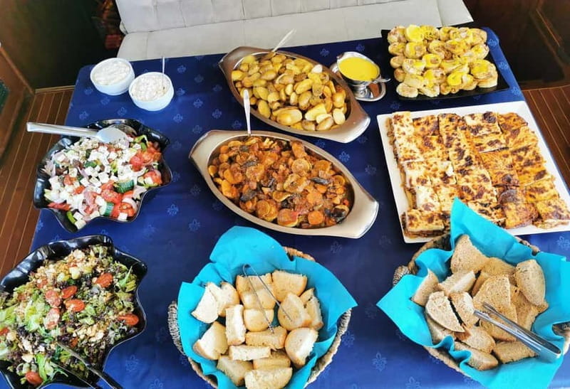 Mykonos: Sunset Sail Cruise to Rhenia with Beach and Dinner - Greek Buffet and Drinks on Board