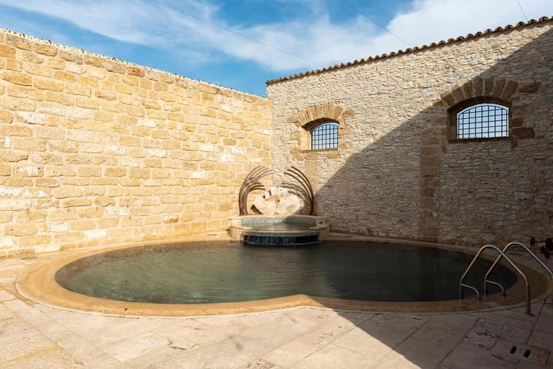 Nature and relaxation by the pool at Baglio Passofondo Estates - FAQ: Practical Questions