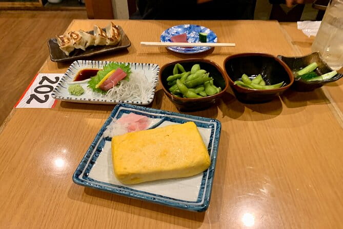 Osaka Nights: Ultimate Pub Bar Crawl With an Expert Local Guide - Discovering Local Cuisine and Drinks