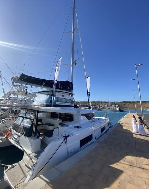 Pasito Blanco: Private catamaran excursion with food & drink - The Sum Up