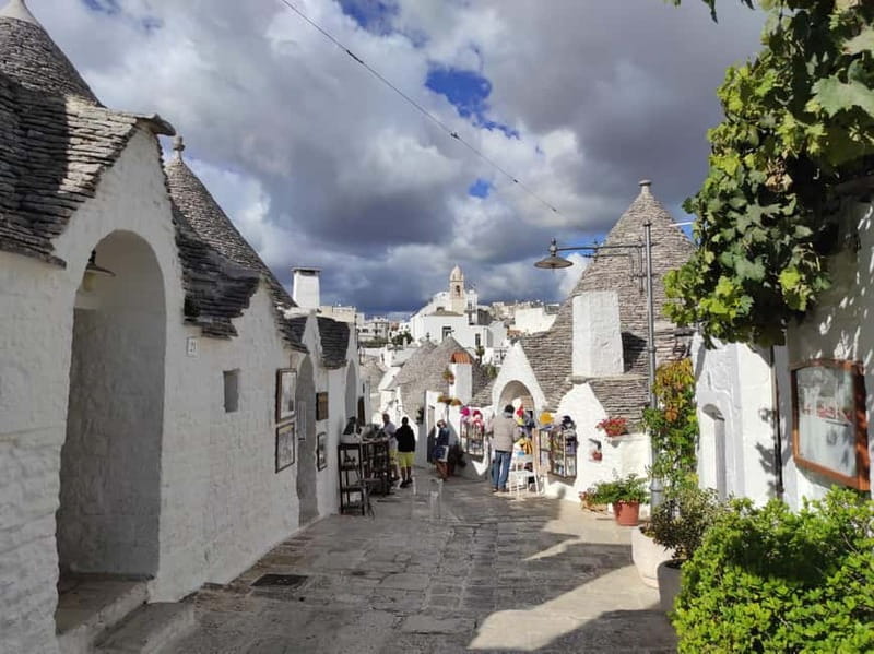 Polignano a Mare & Alberobello: Highliths Tour in Tesla - Alberobello: Fairy Tale Trulli & UNESCO Heritage