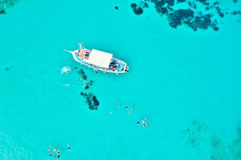 Pounta: Blue Lagoon Boat Tour - The Scenic Journey Begins: Meeting Your Skipper in Pounta