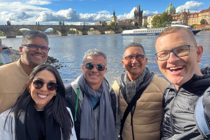 Prague Highlights 4 Hour Private Walking Tour - Crossing the Iconic Bridge: Charles Bridge