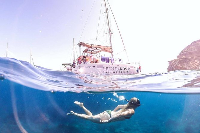 Private Sailing Catamaran in Santorini With BBQ Meal and Drinks - Swimming and Snorkeling Opportunities