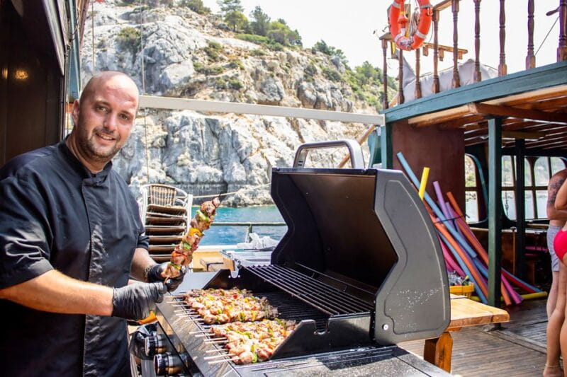 Rhodes: Sunset Cruise with Greek BBQ and Unlimited Drinks - Atmosphere and Group Dynamics