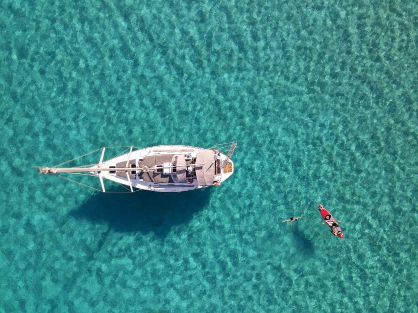 Rhodes Town: Private Sailing Cruise With Swim Stops & Meal - Onboard Amenities and Inclusions