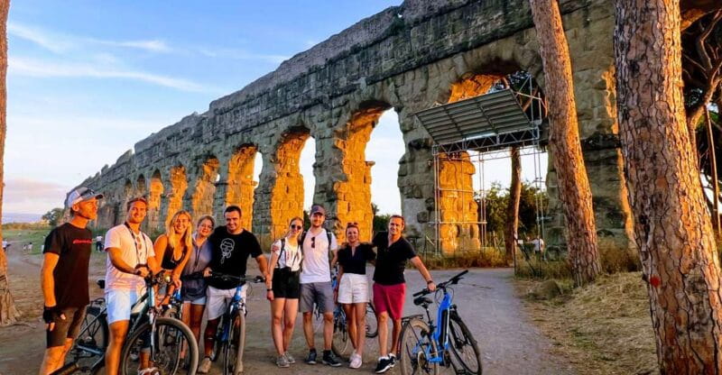 Rome: Appian Way & Catacomb Sunset E-bike Tour with Aperitif - Entering the Appian Way and the Green Landscape