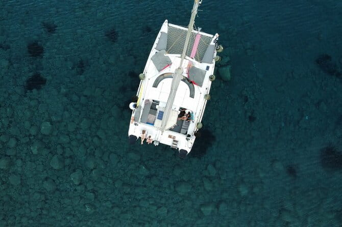 Santorini Catamaran Cruise 5-Hour Private Sailing Experience - First Stop: Red Beach