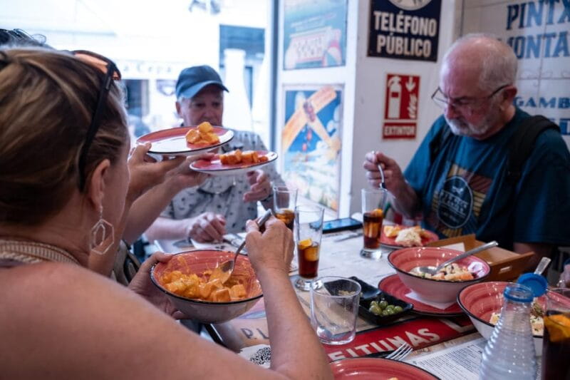 Seville Adventure: Historic Walking Tour & Traditional Tapas - Savoring the Flavors in Local Taverns