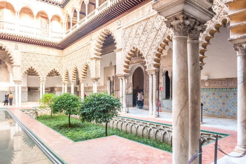 Seville: Cathedral, Giralda & Alcazar Entry With Guided Tour - The Alcazar: A Palace of Cultural Fusion and Gardens