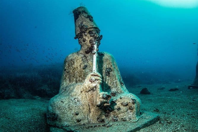 "Side: Scuba Diving in the Fascinating Underwater Museum" - Diving into the Underwater Museum