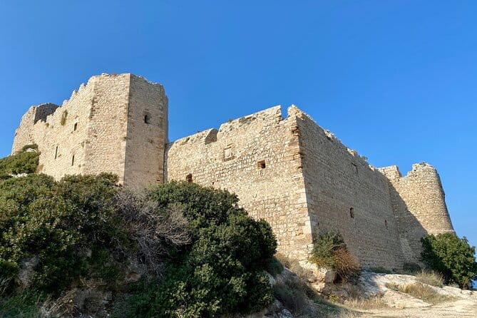 Small group hiking between the beach and Kritinia Castle - The Ascent to Kritinia Castle: A Panoramic Climb
