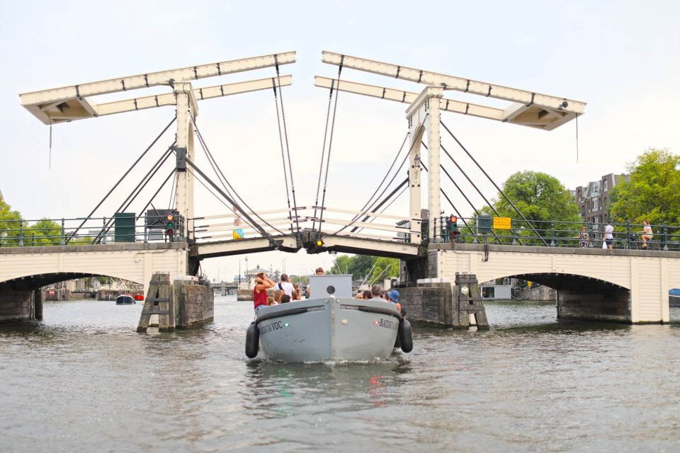 Visit Amsterdam by Boat With a French Guide - Duration and Pricing